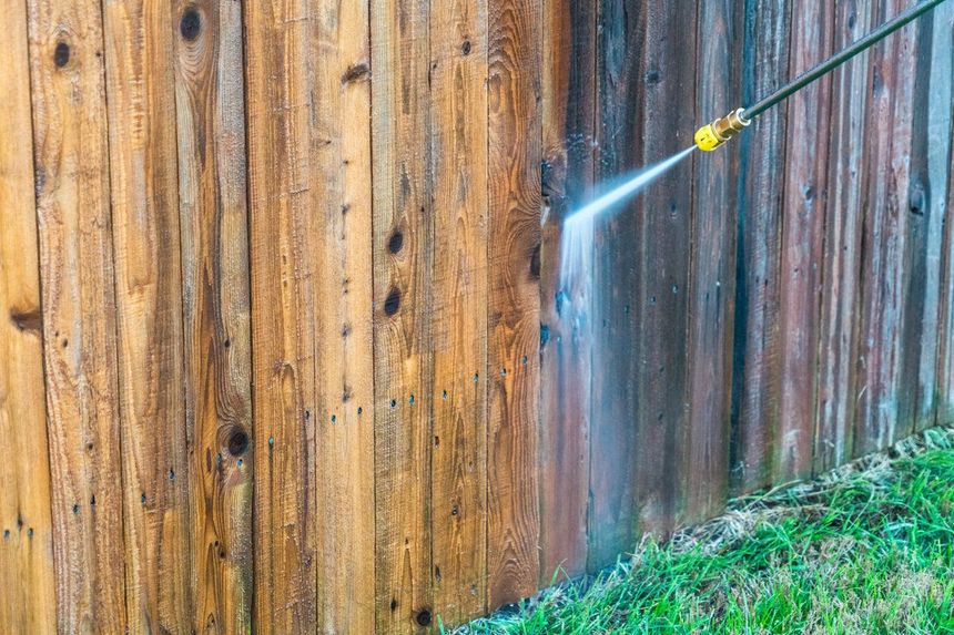 Professional fence cleaning in Titusville FL - vinyl and wood fence pressure washing